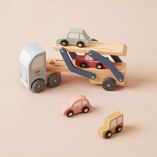 Wooden transporter lorry toy by Just Bee Kids that carries four easy grab wooden cars, designed to develop fine motor skills in toddlers.