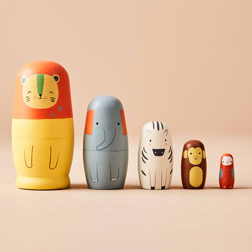 Set of five wooden safari animal nesting dolls by Just Bee Kids, featuring a lion, zebra, elephant, monkey, and parrot.
