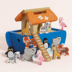 Brightly painted wooden Noah's Ark shape sorter by Le Toy Van, featuring a sliding door, ladder, and six pairs of wooden animal shapes.