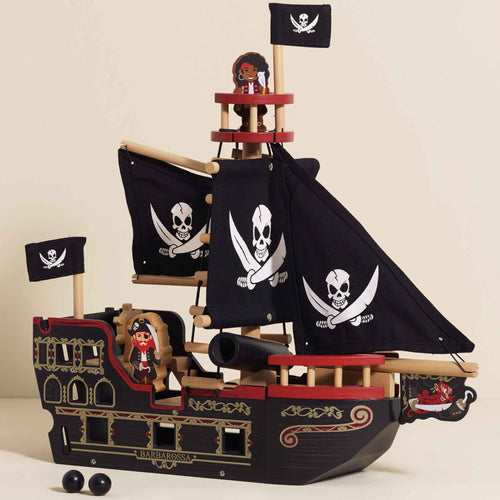 Magnificent Barbarossa wooden pirate ship by Le Toy Van with black fabric sails, a spring-loaded cannon, rigging, and a walk the plank feature.