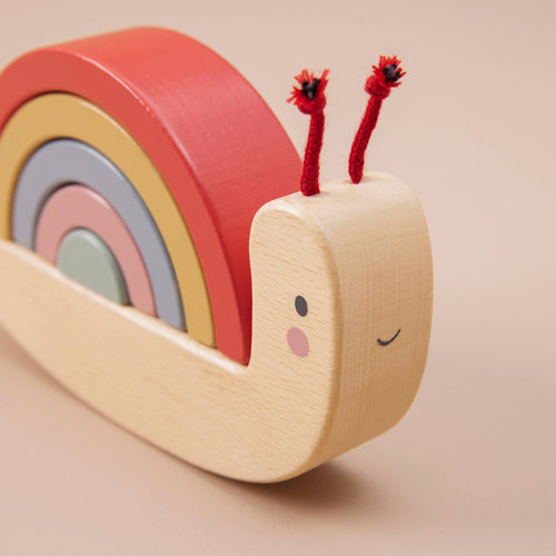 Wooden Snail Stacker Toy by Just Bee Kids with rainbow coloured stacking rings, designed to teach colours and sizes to toddlers.
