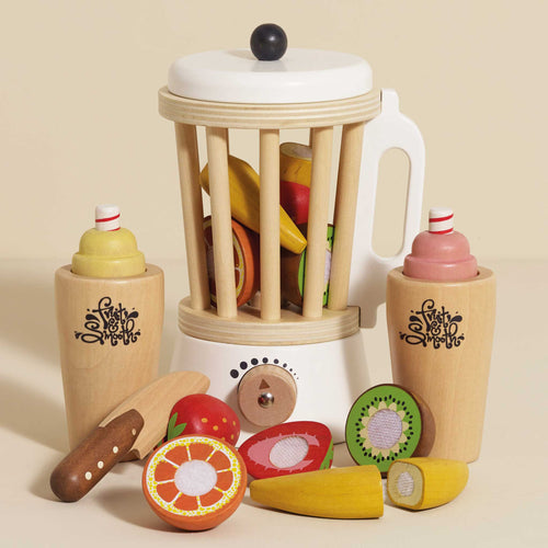 Wooden smoothie set by Le Toy Van with a retro style blender, sliceable fruits, a play knife, and two wooden tumblers with removable toppings.