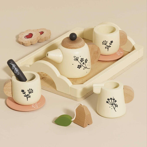 12-piece wooden tea set by Le Toy Van on a serving tray, featuring cups, saucers, a teapot, milk jug, and wooden biscuits.