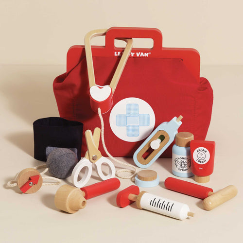 Wooden pretend play doctor's bag by Le Toy Van, featuring a red fabric bag and 9 wooden accessories including a stethoscope and thermometer.
